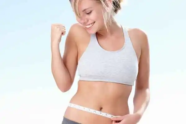woman happy after fat reduction treatment Oldham