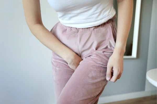 woman struggling with urine incontinence Oldham